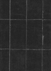 Fototapeta premium Dark folded paper texture background with grid creases, grunge black paper sheet surface for vintage poster design, distressed paper overlay texture abstract background