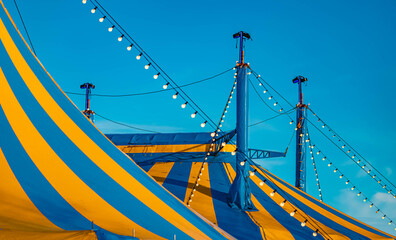 Winter landscape on a sunny day with a blue and yellow circus tent at Straubing, Bogen, Bavaria, Germany