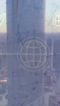 Vertical video: On start view panning left revealing tower, skyline, globe overlay sliding on glass