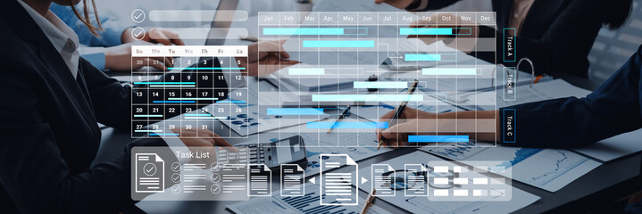 A modern office scene showcasing teamwork in project management. Professionals collaborate using...