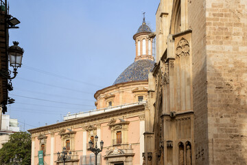 Valencia Cathedral and Royal Basilica of Our Lady of the Forsaken (Real Bas&iacute;lica de Nuestra Se&ntilde;ora de los Desamparados) from Plaza de la Virgen, Valencia, Spain. 