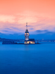 Maiden's Tower (Kiz Kulesi) in Istanbul at sunset with a purple sky, panoramic view of the Bosphorus and the historical peninsula