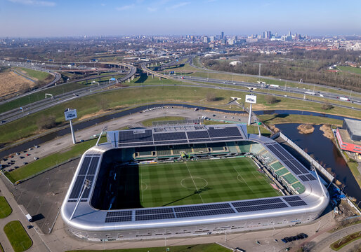 Aerial of ADO Den Haag football stadium soccer stadion field in The Hague with city skyline in the background. Dutch National championship premier league venue seen from above in The Netherlands
