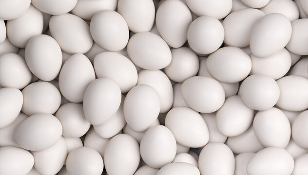 Close up background texture of many natural white chicken eggs forming a clean organic food pattern with soft lighting and minimal composition.