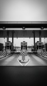 Monochrome Toll Booth Perspective Capturing Geometric Lines and Architectural Symmetry in Daylight