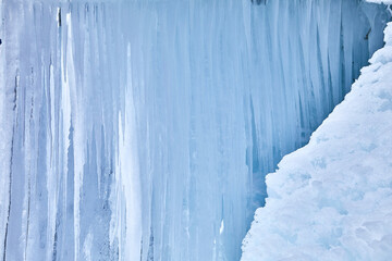 Beautiful ice sculpture with large icicles, detail.