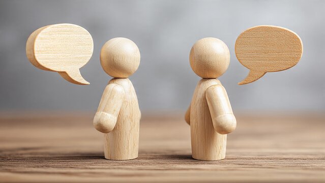 Two Wooden Figures Having Dialogue with Empty Speech Bubbles, Concept of Business Communication, Networking, Consulting, and Social Interaction
