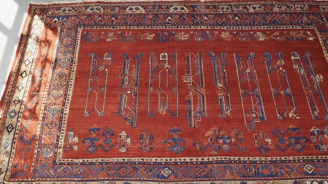 Intricate Traditional Persian Rug Detail: Close-up of Complex Geometric Pattern and Rich Red Wool Texture.