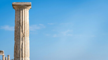Ancient Greek column against blue sky symbolizing classical civilization