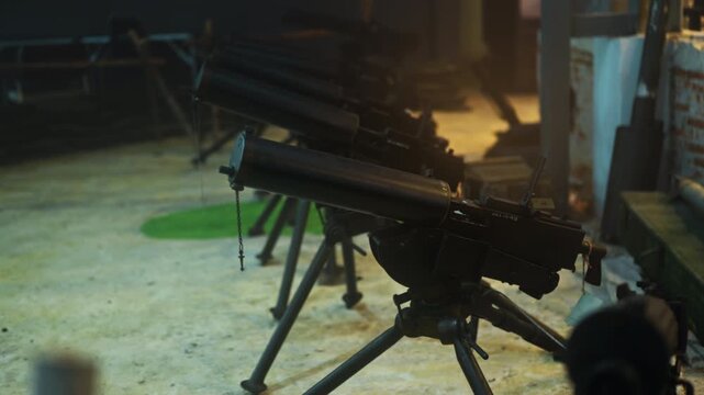 Anti-personnel weapons stand in the destroyed barricades of the city with destroyed brick walls. Thick fog.