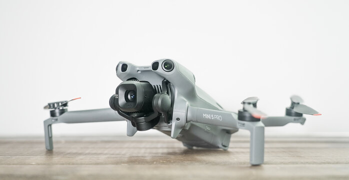 NORWALK, CT, USA - MARCH 2, 2026: Gray DJI Mini 5 Pro unmanned aerial vehicle featuring a sophisticated gimbal camera system for professional videography and photography
