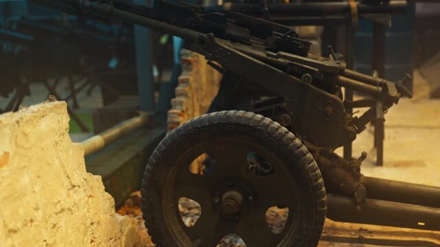 Anti-personnel weapons stand in the destroyed barricades of the city with destroyed brick walls. Thick fog.
