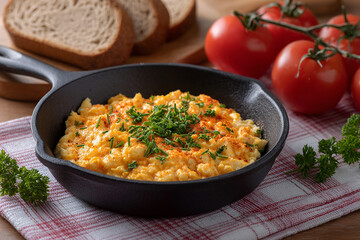 Traditional Menemen or Turkish Scrambled Eggs with Tomatoes on the table
