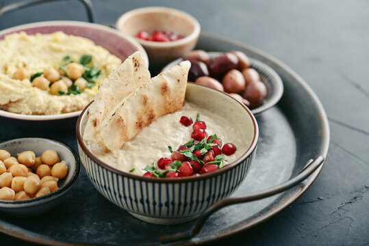 Middle eastern, arabic traditional breakfast with hummus, falafel, mutabbal,