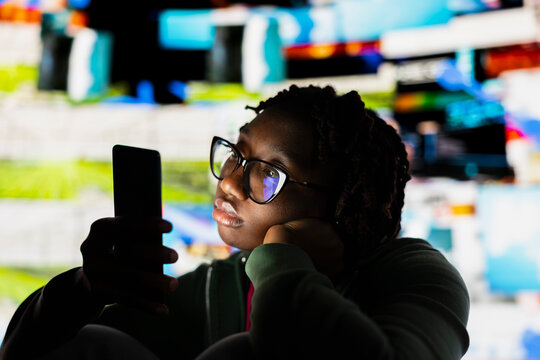Apathetic woman addicted to social media, unable to stop using smartphone, wasting her life. Couch potato person staring at phone screen, concept of technology overuse and digital dependence