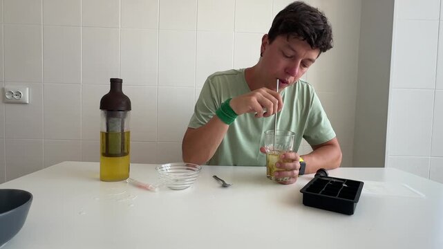 Youthful tasting scene. Freckled man enjoying flavorful olive oil