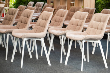 Fototapeta premium Empty chairs lining up in rows ready for a conference or corporate meeting