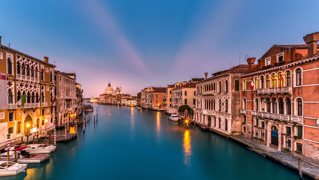 View of Venice with Grand Canal and Basilica Santa Maria della Salute at dusk