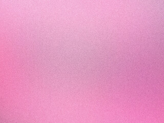 Fototapeta premium A pink background with a grainy texture.