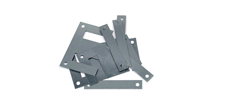 Ferrite core in a transformer on a white background.