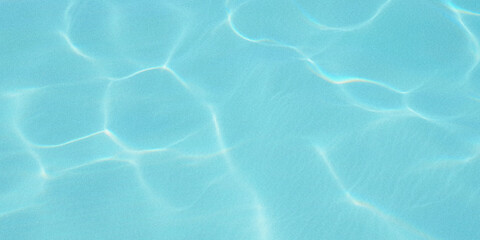 Abstract view of turquoise water with sunlight creating shimmering patterns © Nasrin