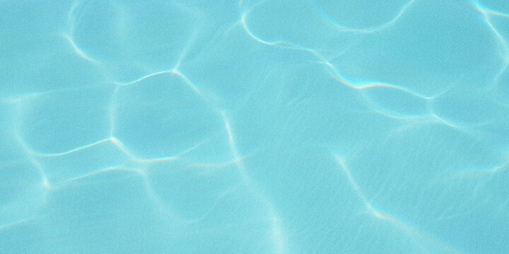 Abstract view of turquoise water with sunlight creating shimmering patterns