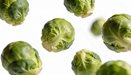 Fototapeta premium Fresh Brussels sprouts tumbling and floating in mid-air against a clean white background
