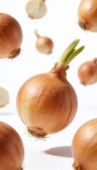 Fresh yellow onions with green sprouts floating in the air against a white background