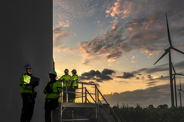 Obraz premium Visionary green collar workforce managing sustainable wind power grid at sunset. Dedicated engineers committed to global ESG and decarbonization.