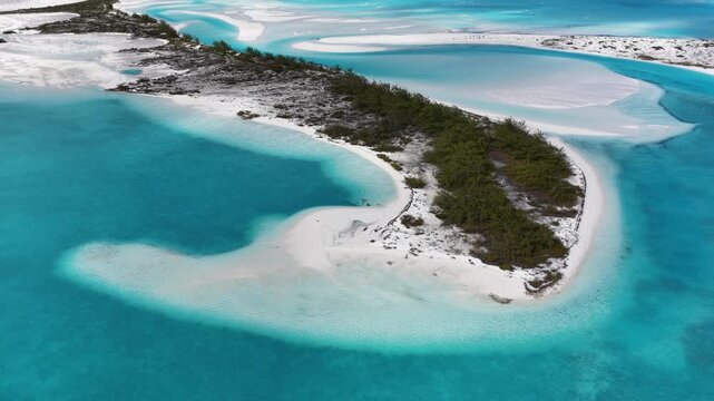 Aerial view of Man-O-War Cay in Moriah Harbour Cay National Park showing the island and sandbars in the Exumas, Bahamas.