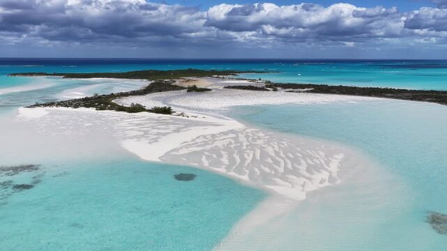 Aerial view of Man-O-War Cay in Moriah Harbour Cay National Park showing the island and sandbars in the Exumas, Bahamas.