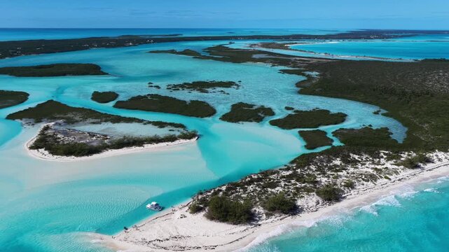Aerial view of a tour boat at The Cut, also known as the Lazy River, a natural feature that flows with the tide either in from the ocean or out towards the ocean.