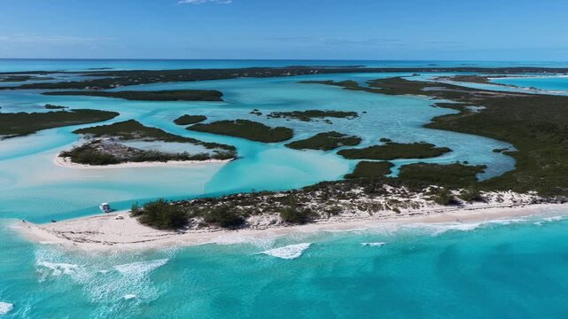 Aerial view of a tour boat at The Cut, also known as the Lazy River, a natural feature that flows with the tide either in from the ocean or out towards the ocean.