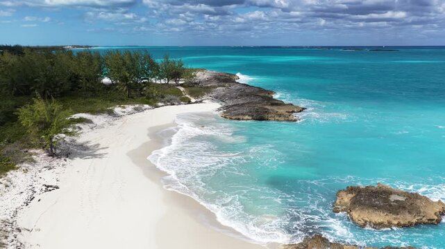 Aerial view of Forbes Hill Beach with gentle waves on Great Exuma in the Exumas, Bahamas.