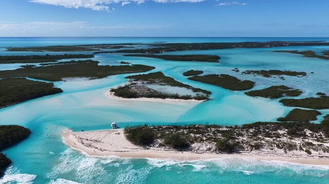 Aerial view of a tour boat at The Cut, also known as the Lazy River, a natural feature that flows with the tide either in from the ocean or out towards the ocean.