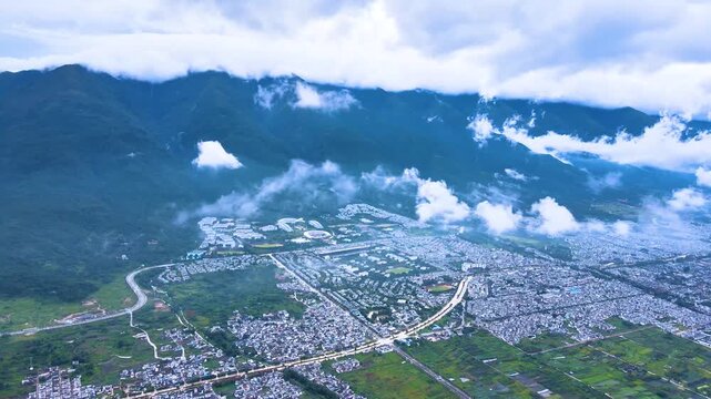 Cangshan Mountains Aerial View with Valley City and Clouds