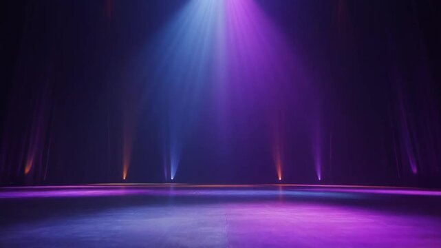 Empty stage with colorful spotlights and atmospheric haze.