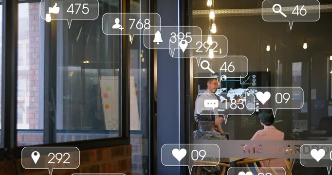 Presenter pointing at display and causing social icons to stack across glass for marketing reach