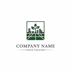 Green Logo Design with Cityscape and Leaves.