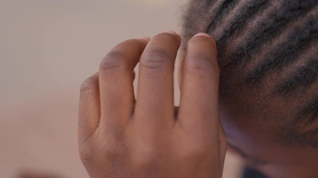 Closeup of girl reviewing her hair texture. Detailed image showing woman inspecting intricate hairstyle features. Close photo of girl closely analyzing her hair texture and style details