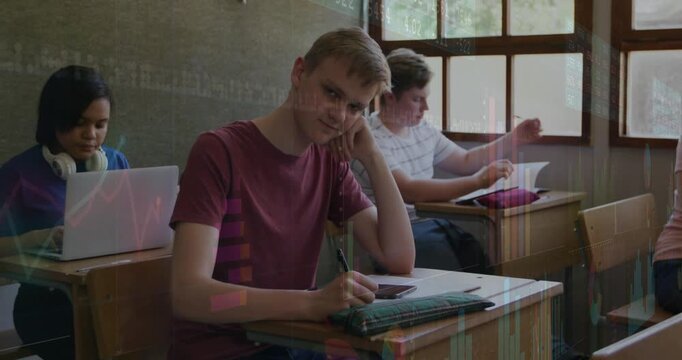 Vertical video: Teen class watching red tee teen noting phone buzz, writing smiling in class graphs