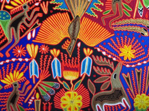 wallpaper of a colorful traditional mexican textile (wixarika)