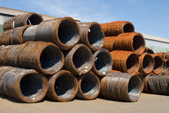 Canada, Surrey, BC.  rolls of metal wire outside metalwork factory.