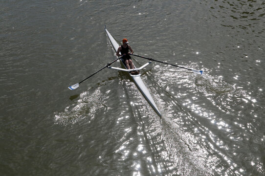Canada, BC, Fort Langley.  Overhead view of man rowing a single scull on the Fraser River.