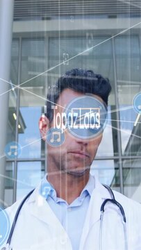 Vertical video: Dr using tablet as TopazLabs logo appearing, AR medical icons animating, consulting