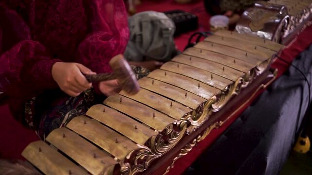 Traditional Indonesian Gamelan Musician Playing Saron Instrument
