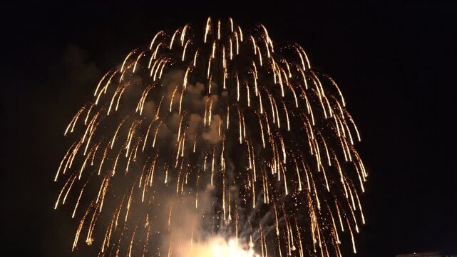 Celebratory Fireworks Lighting Up Night Sky Over City