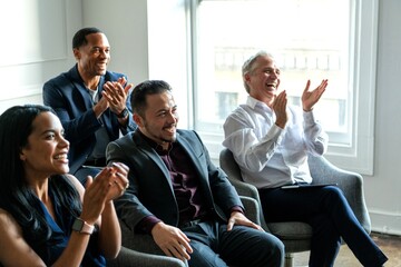 Obraz premium Diverse professionals applauding success.