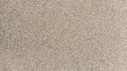 Aerial top view of sea beach sand texture background with natural coastal pattern, soft golden grains and shoreline surface detail, minimal summer seaside backdrop in high resolution nature texture
