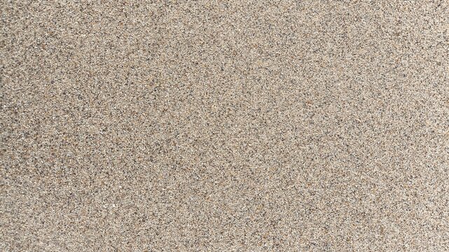 Aerial top view of sea beach sand texture background with natural coastal pattern, soft golden grains and shoreline surface detail, minimal summer seaside backdrop in high resolution nature texture